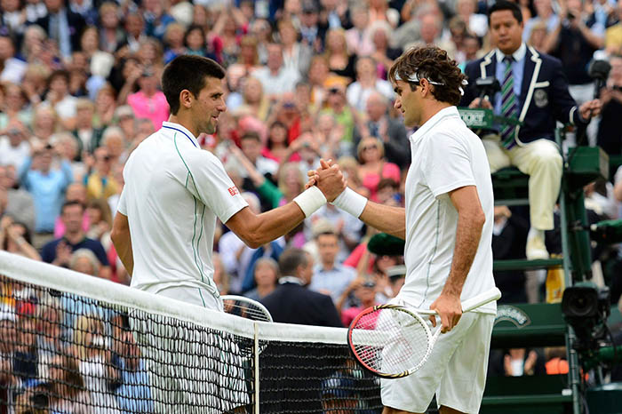 Roger-Federer-shakes-hand-swith-Serbias-Novak-Djokovic-after-his-mens-singles-semi-final-victory