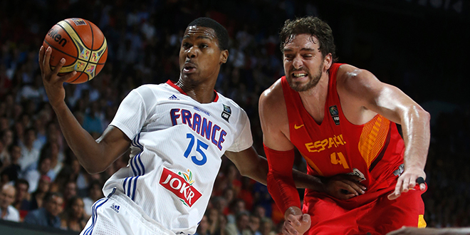Spain's Pau Gasol and France's Gelabale fight for a rebound during their Basketball World Cup quarter-final game in Madrid